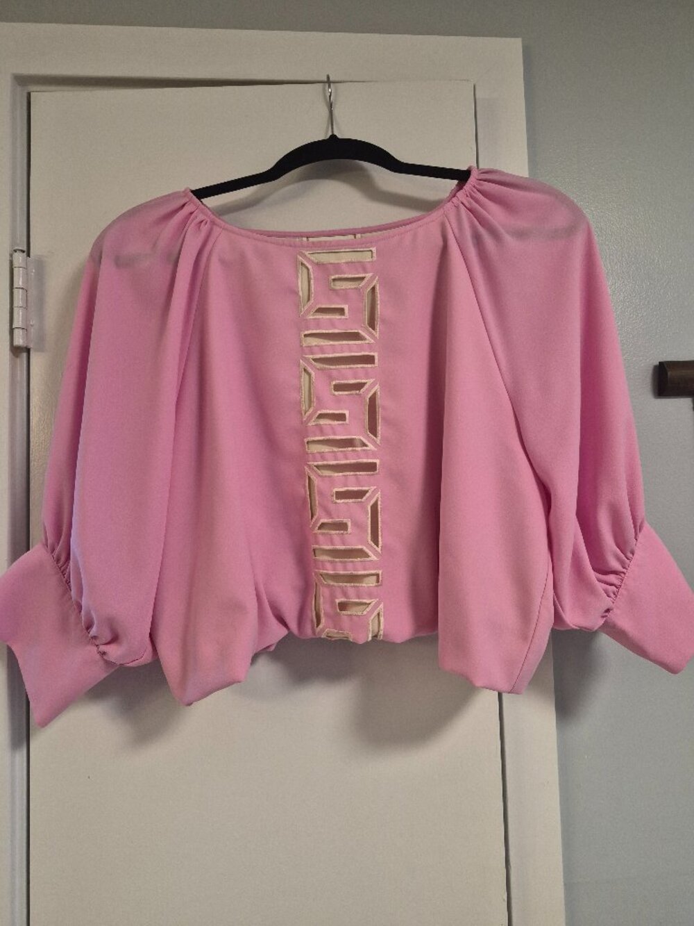 Emily McCarthy barbie pink top with Emily McCarthy logo running down front &back